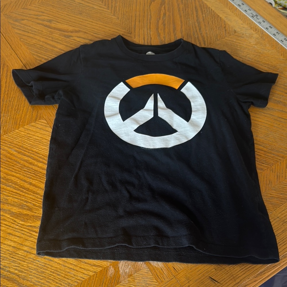 Old Navy black tshirt with an orange and white emblem